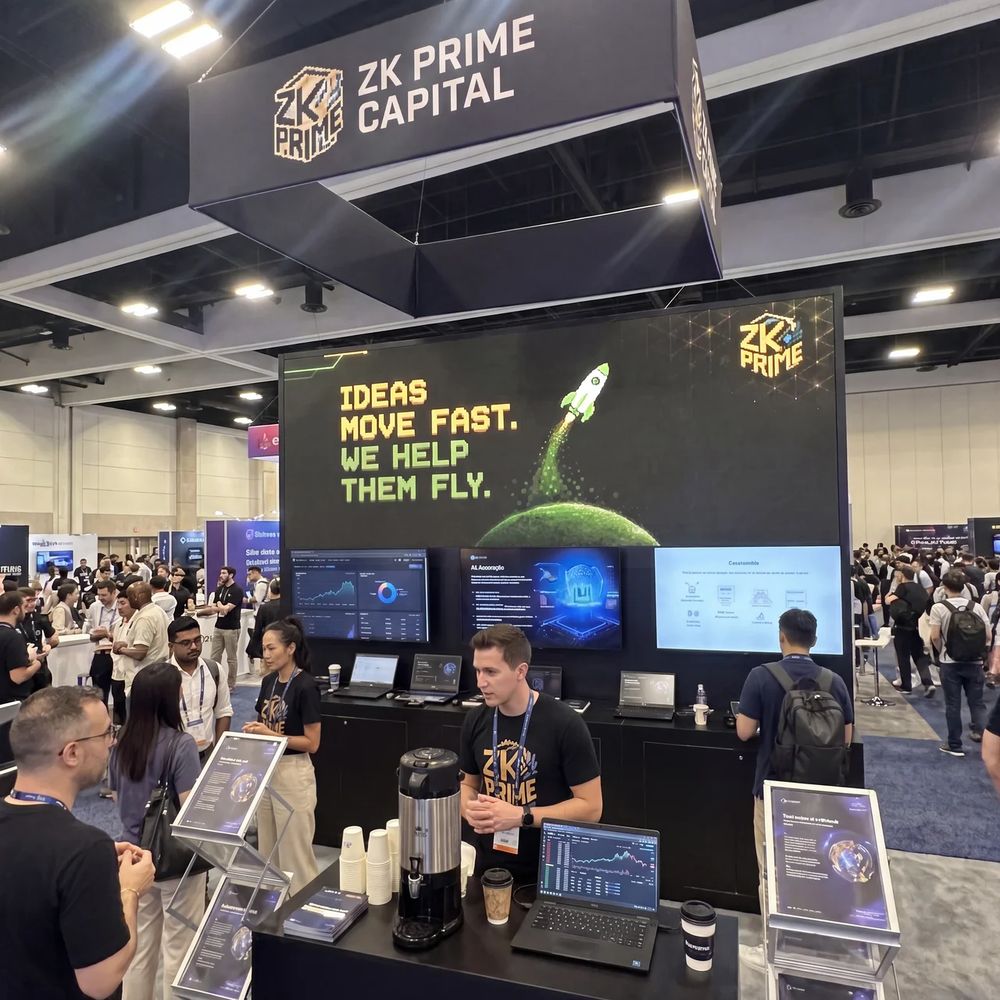 ZK Prime team at the booth talking with conference attendees